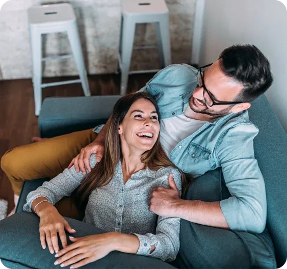 couple relaxing and laughing in pest free home