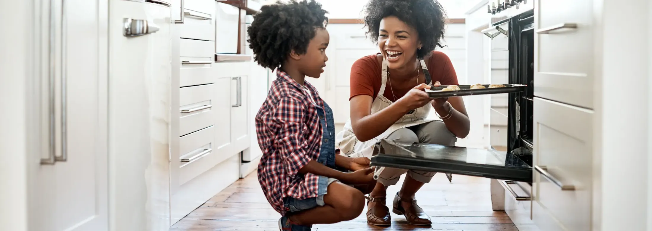 mother and son baking in kitchen