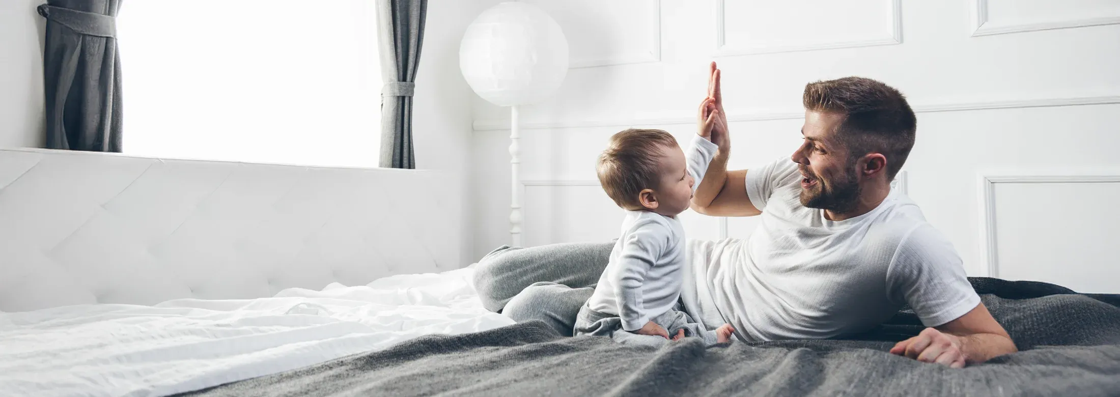 father playing with baby in pest free home
